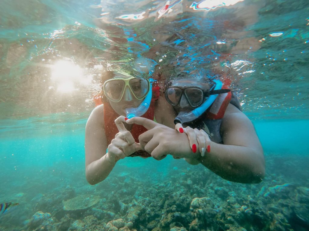 Diving or snorkeling amidst reefs